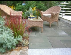 Thermal bluestone patio surrounded by perennial garden