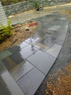 A multi colored Thermal Bluestone walkway 